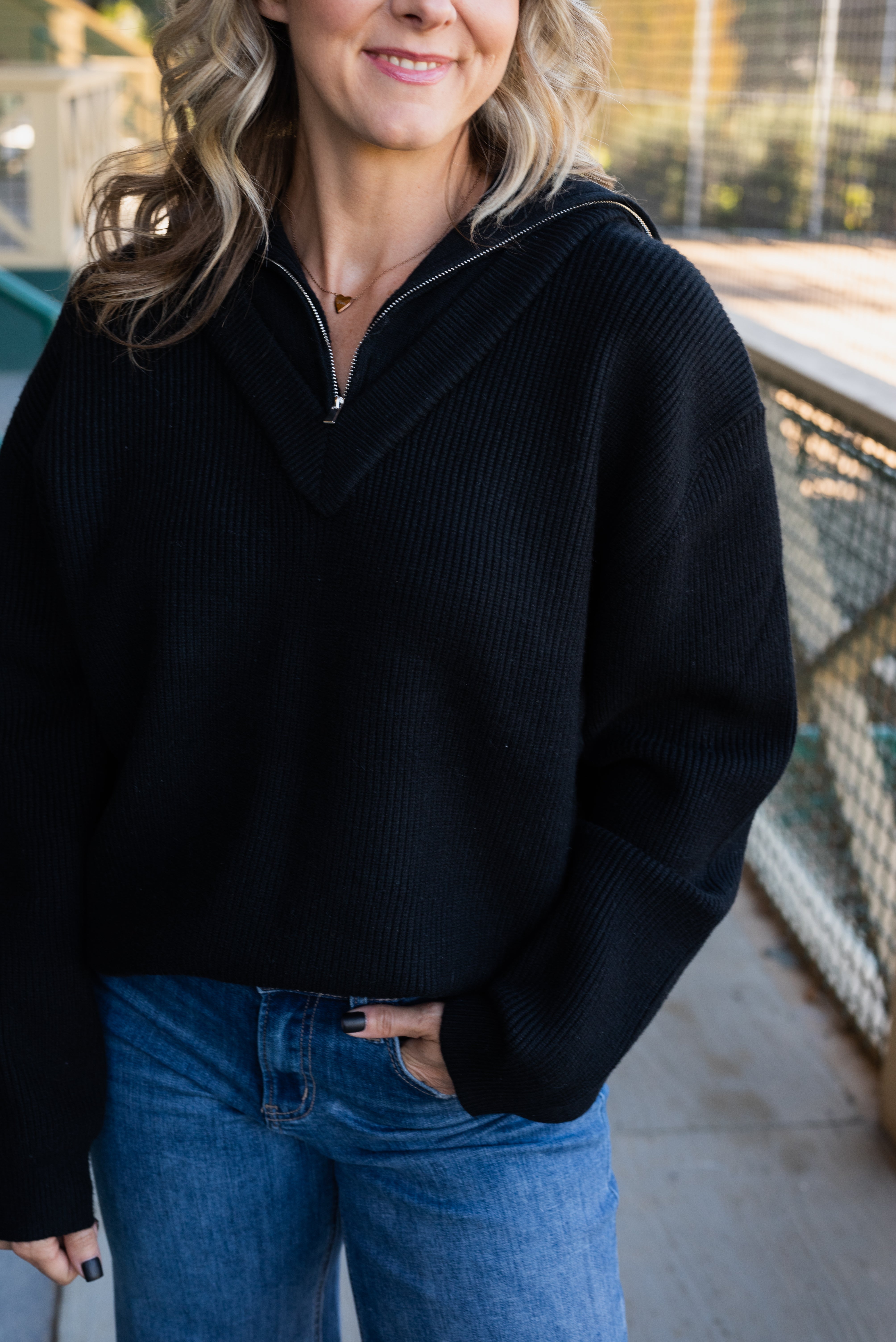 LOGAN HALF ZIP SWEATER